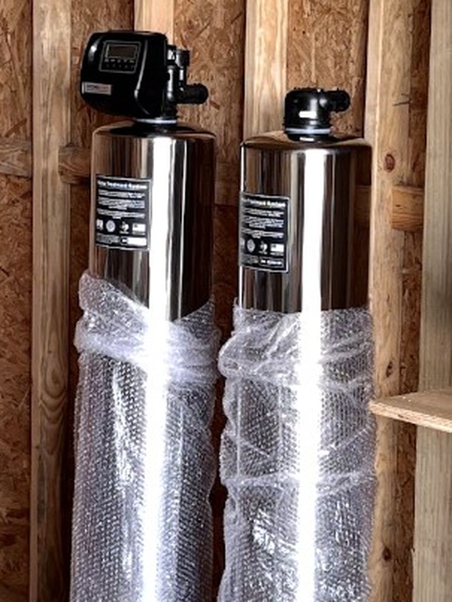 Water softener tanks installed in a Houston garage